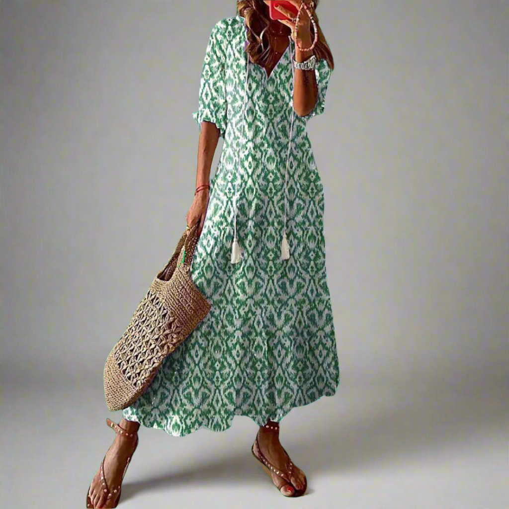 Dames bloemen maxi jurk, A-lijn model. Comfortabele en chique zomerjurk met v-hals en korte mouwen.