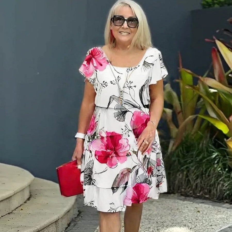 Mooie bloemenprint zomerjurk voor dames met luchtig waterval-design en verstelbare schouderbandjes.
