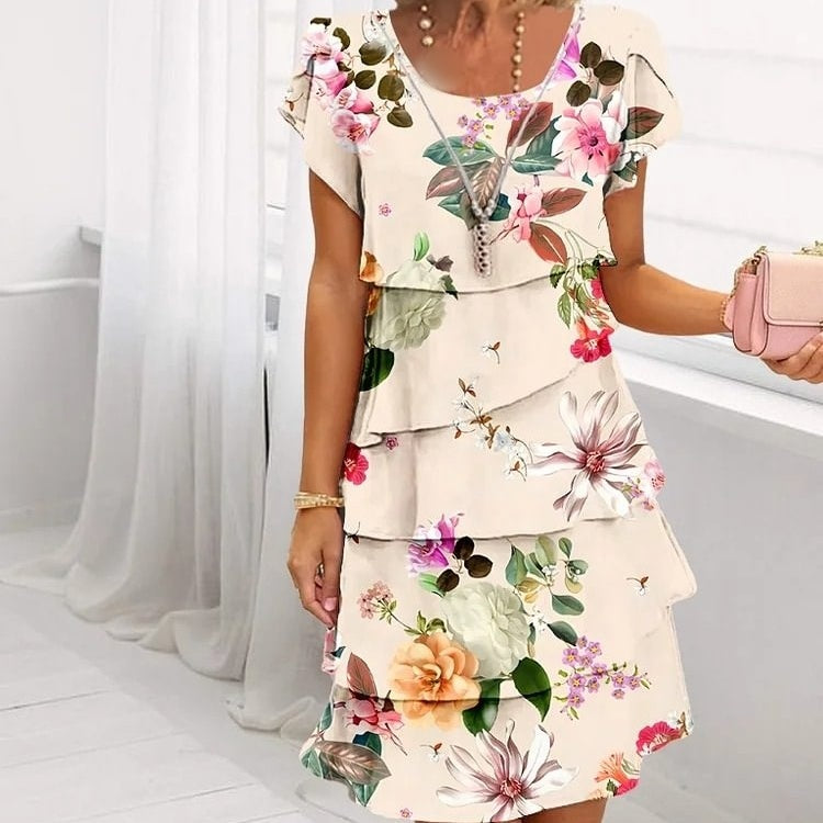 A-lijn dames zomerjurk met een prachtige bloemenprint en watervalhals, ideaal voor warme dagen.