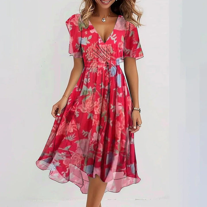 Dames bloemen wikkel midijurk met elegante print. Comfortabele zomerjurk voor casual of feestelijke gelegenheden.