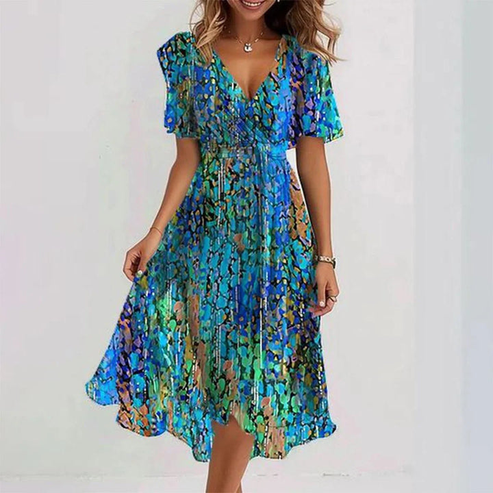 Stijlvolle dames bloemen wikkeljurk, perfect als zomerjurk of feestjurk. Elegant en comfortabel, midilengte.