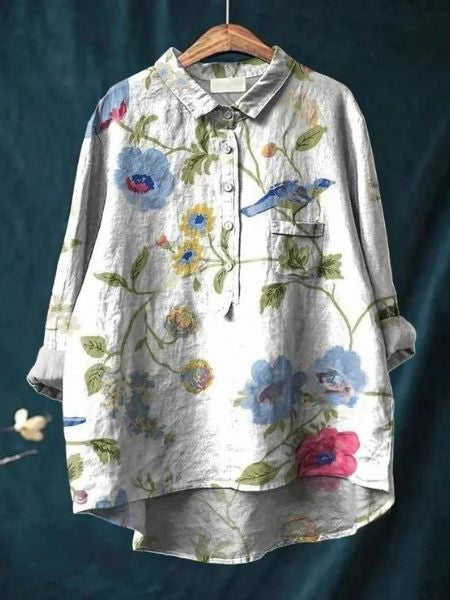 Zomer mode dames top: bloemenprint, knoopsluiting, lange mouwen. Comfortabel en stijlvol.