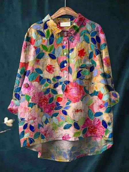 Casual chic dames top met kleurrijke bloemenprint, lange mouwen en trendy knoopsluiting. Zomerklaar.