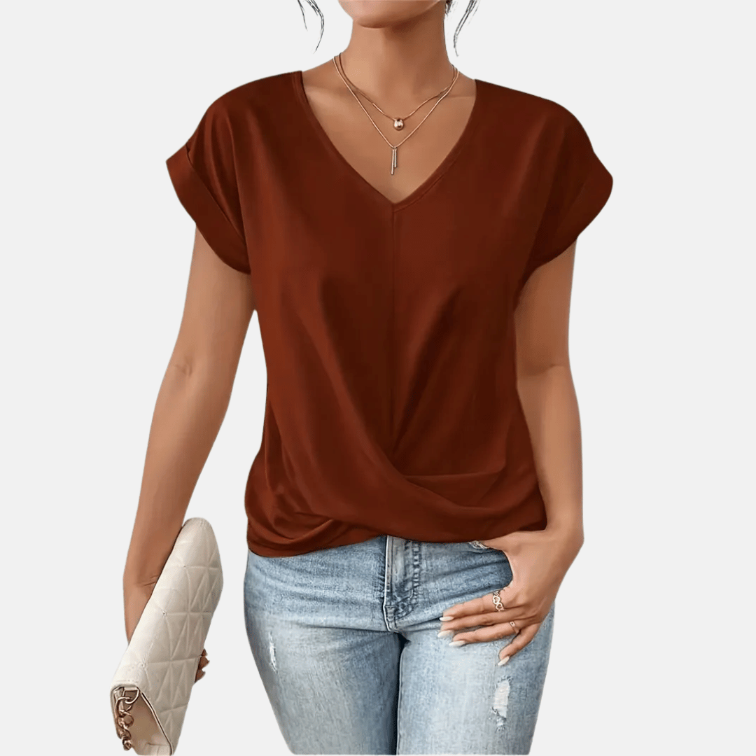 Comfortabele dames top met elegante V-hals, effen en gedrapeerde zoom. Geschikt voor elke gelegenheid.