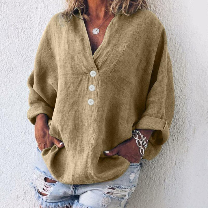 Veelzijdige dames blouse met lange oprolmouwen en knoopjes, modieus voor lente- en zomeroutfits.
