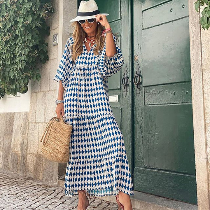 Veelzijdige Cazual™ jurk, V-hals en pofmouwen. Geschikt als casual zomerjurk of elegante avondoutfit.