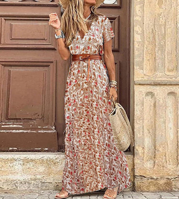 Model draagt luchtige dames boho maxi jurk met V-hals en korte mouwen, perfecte zomer/lente kleding.
