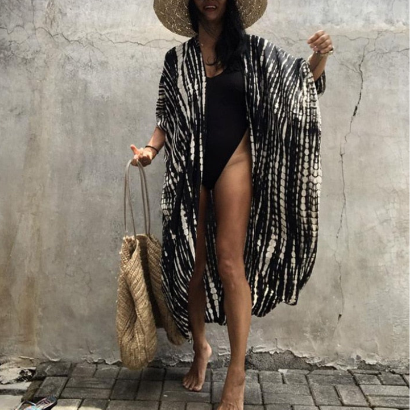Dames boho strandblouse met kimonomouwen, perfect voor zomer en strand, losse pasvorm. Stijlvol en comfortabel.