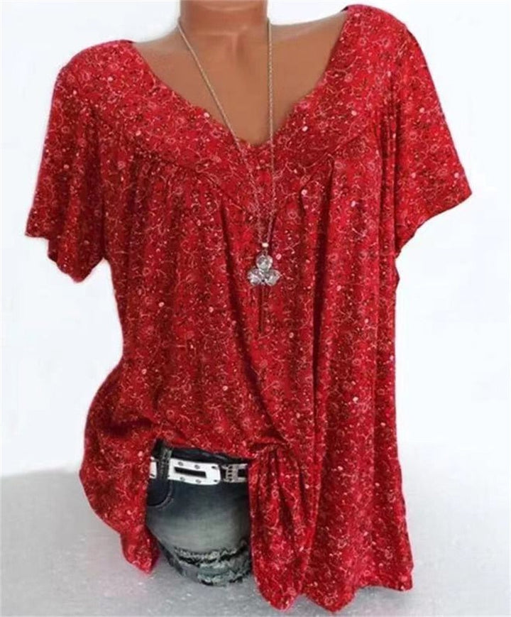 Celeste dames zomerblouse in boho stijl met bloemenprint, korte mouwen en comfortabele losse pasvorm.