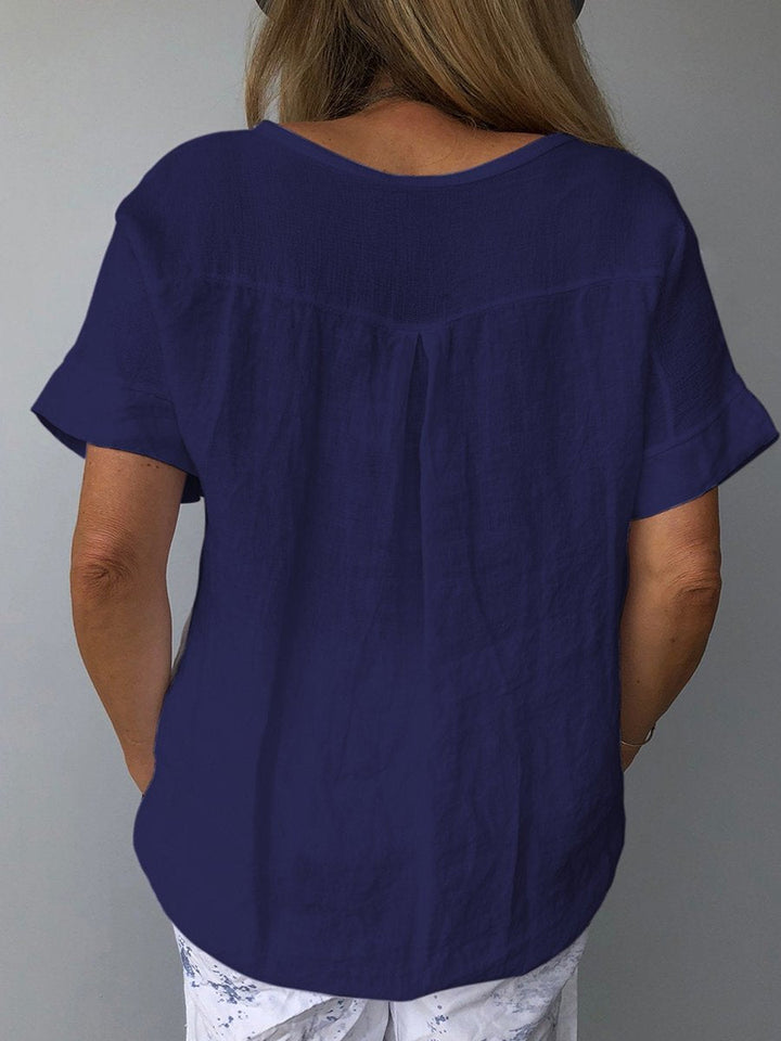Casual dames V-hals top met losvallende pasvorm en korte mouwen. Perfecte zomer top voor dagelijks comfort.