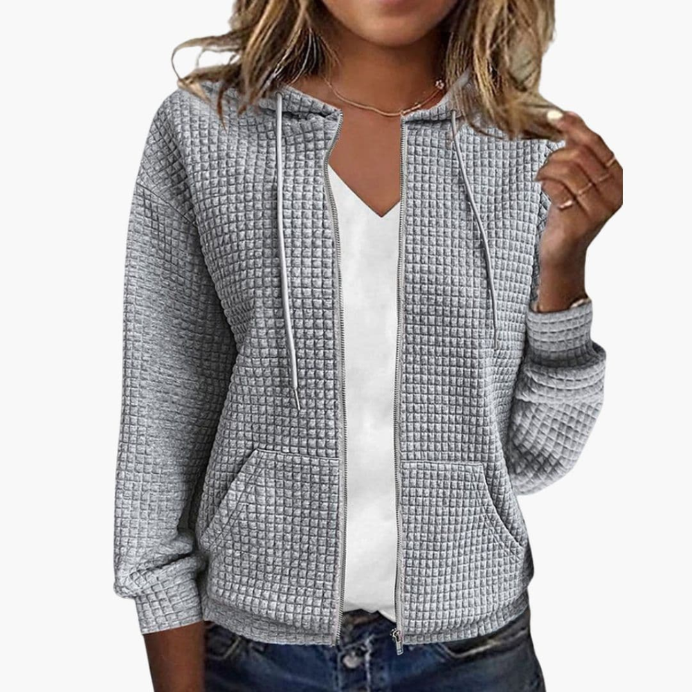 Zachte dames zip-up hoodie met wafeltextuur en verstelbare trekkoordkap, perfect voor comfort en stijl.