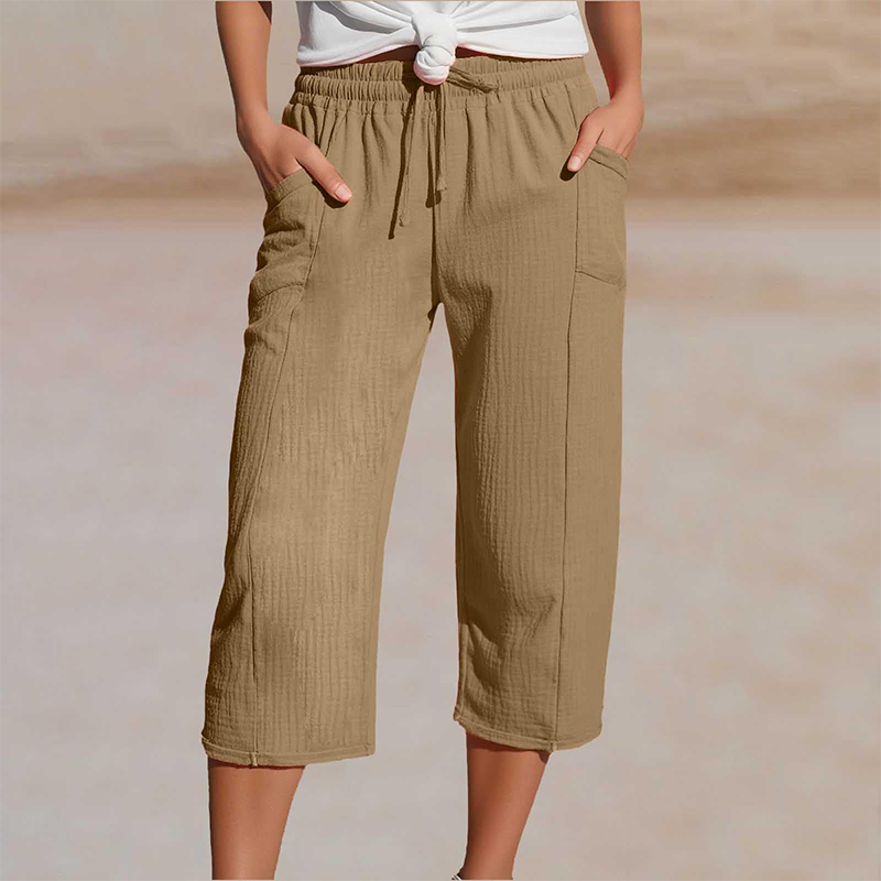 Comfortabele dames capri broek met wijde pijpen en verstelbare tailleband, ideaal voor ontspanning.