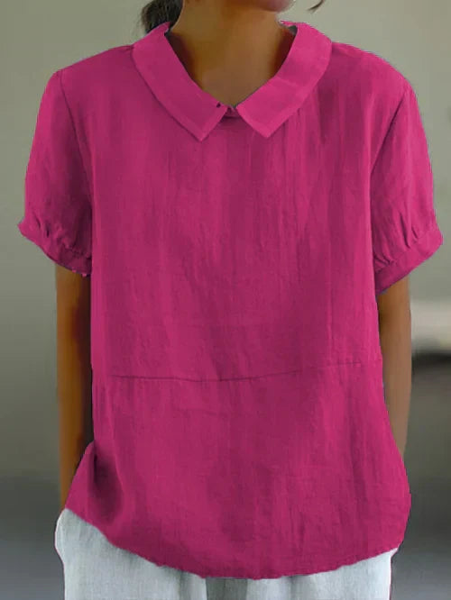 Modieuze dames blouse met unieke Peter Pan kraag en pofmouwen. Creëer een elegante, trendy look voor elke dag.