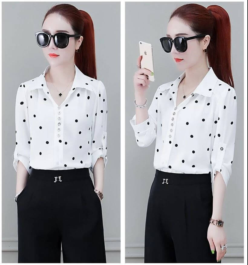 Chique dames blouse met omgeslagen kraag, knoopsluiting en elegante uitstraling.
