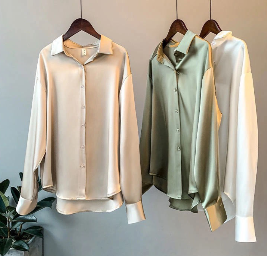 Groene damesblouse met lange mouwen, elegant en tijdloos. Ideaal voor formele kleding of een casual chic look.