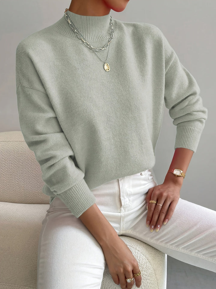 Warme gebreide damestrui met elegante hoge kraag, perfect voor casual of elegante herfst outfits.