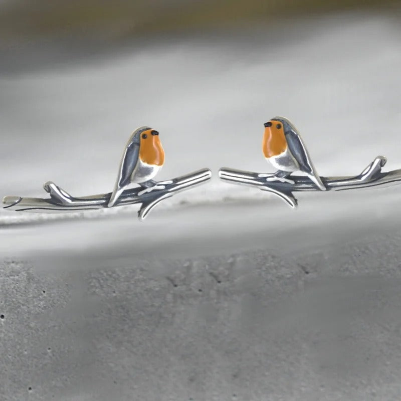 Glanzende geluksvogel sieradenset van metaal, dames ketting en oorbellen, symbool voor hoop en nieuw begin.