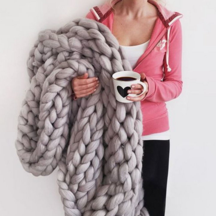 Dames grof gebreide woondeken, perfect voor comfort en warmte in de winter.
