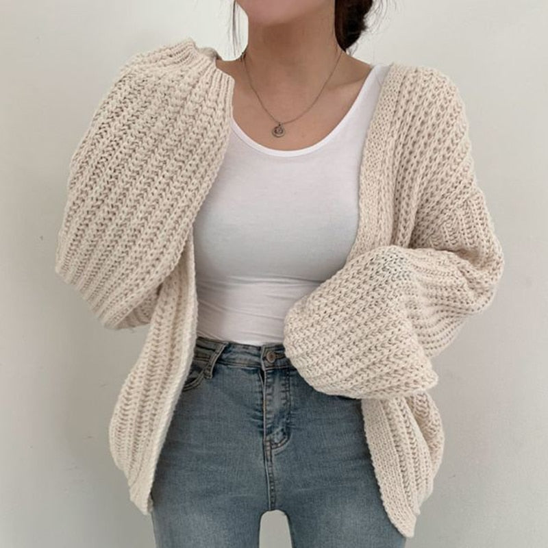 Stijlvol AnniesVest: oversized cardigan met trendy ballonmouwen, perfect voor damesmode & comfort.