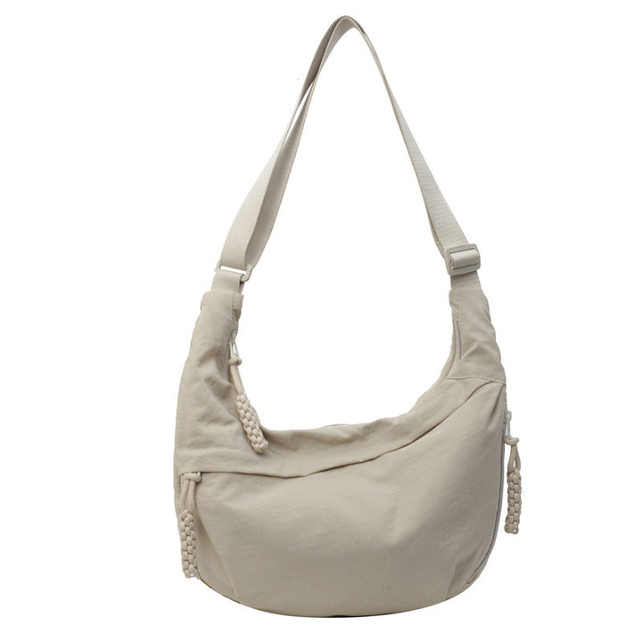 Veelzijdige dagelijkse halvemaan crossbody tas van nylon, ruime dames schoudertas en accessoire.