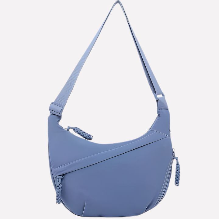 Achterkant van de zwarte halvemaan dames crossbody tas, comfortabel en modieus design.