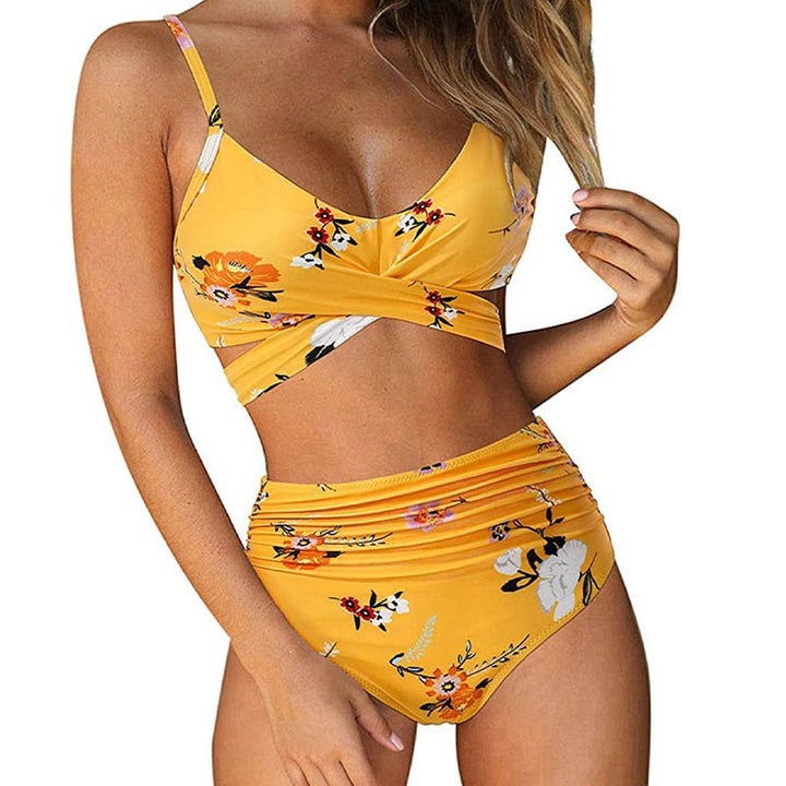 Dames high waisted bikini met levendige bloemenprint, ideaal voor strand en zwembad.