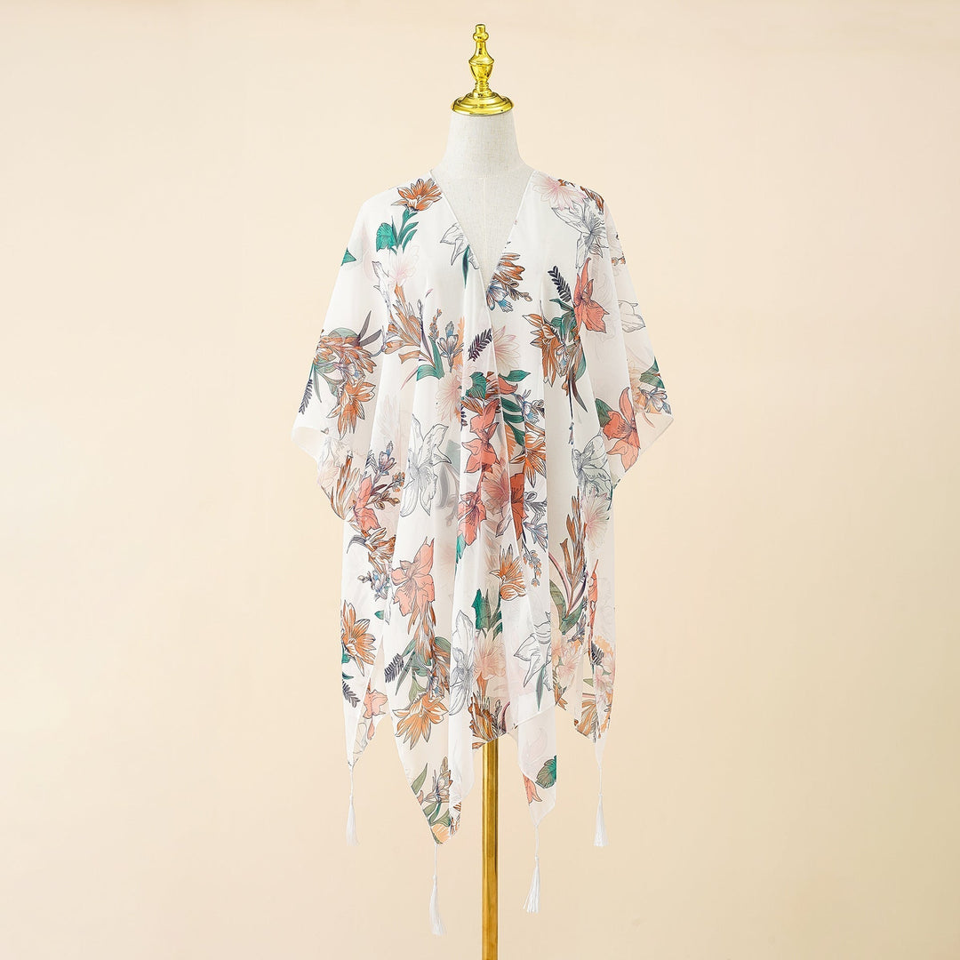 Lichtgewicht dames kimono cover-up Liora met bloemenprint en speelse tassels, comfortabele strandkleding.
