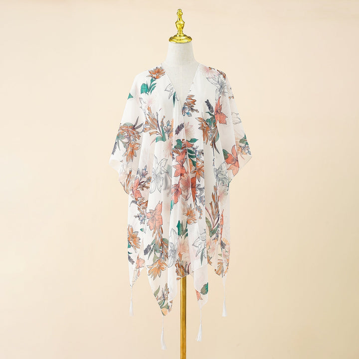 Lichtgewicht dames kimono cover-up Liora met bloemenprint en speelse tassels, comfortabele strandkleding.