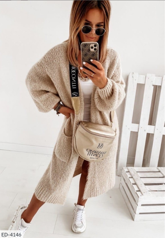 Warm gebreid lang vest voor dames, een comfortabele trui met zakken voor koude herfst- en winterdagen.