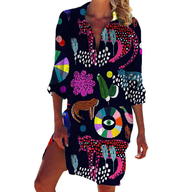 Luchtige damesblouse met tropische bloemenprint, ideaal als casual zomerkleding. Lange pasvorm, korte mouwen.