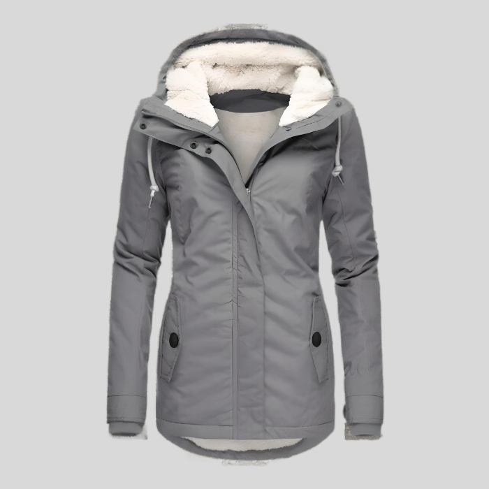 Nieuwe collectie: Lange waterdichte winterjas voor dames, warm gevoerd en met capuchon. Ideale wintermode.