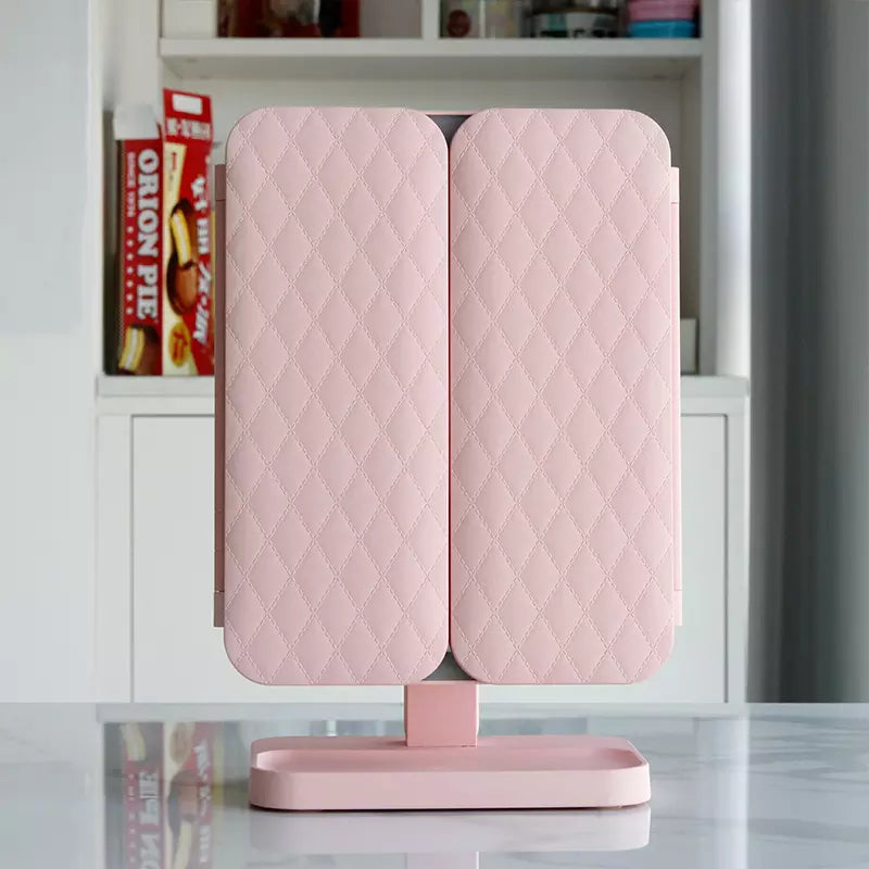 Verlichte opvouwbare make-up spiegel Clara met vergrotende panelen, perfect voor elke kaptafel.