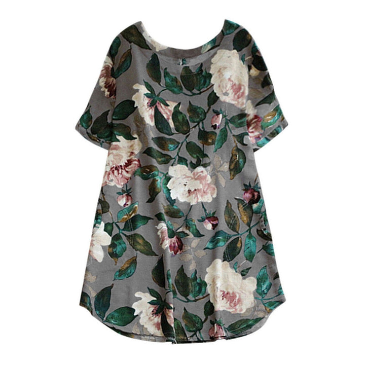 Kleurrijke bloemenprint op deze Malina dames zomerjurk met korte mouwen. Perfect voor zonnige dagen.
