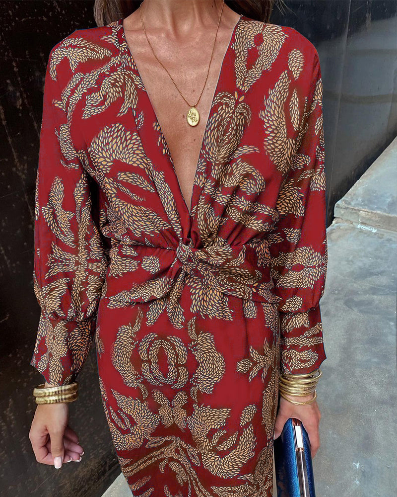 Levendige print maxi-jurk voor dames met elegante twist voorkant en flatterende V-hals. Zomerse chic.
