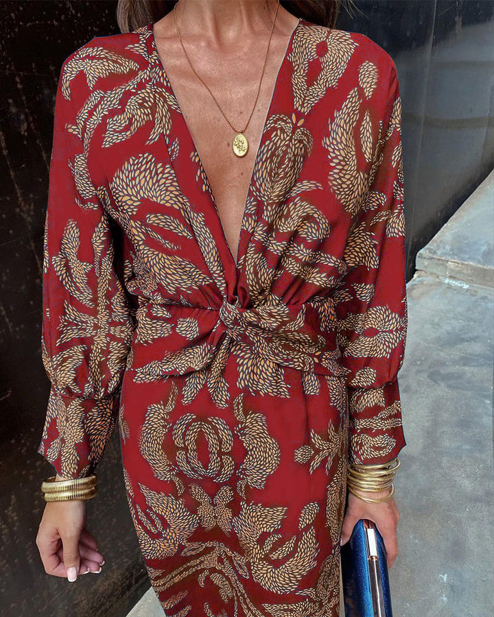 Levendige print maxi-jurk voor dames met elegante twist voorkant en flatterende V-hals. Zomerse chic.