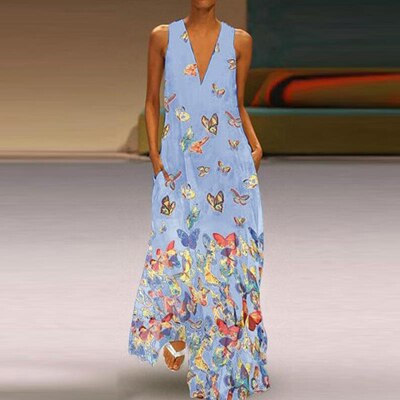 Trendy dames maxi jurk Malia, met opvallend vlinderdesign. Mouwloos, perfect voor zomer en strand.