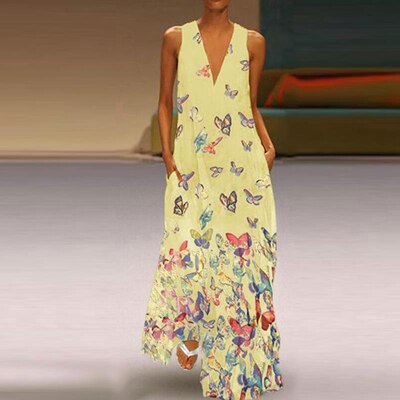 Zomerse dames maxi jurk met levendig vlinderpatroon. Trendy, mouwloos en ideaal voor vakantie.