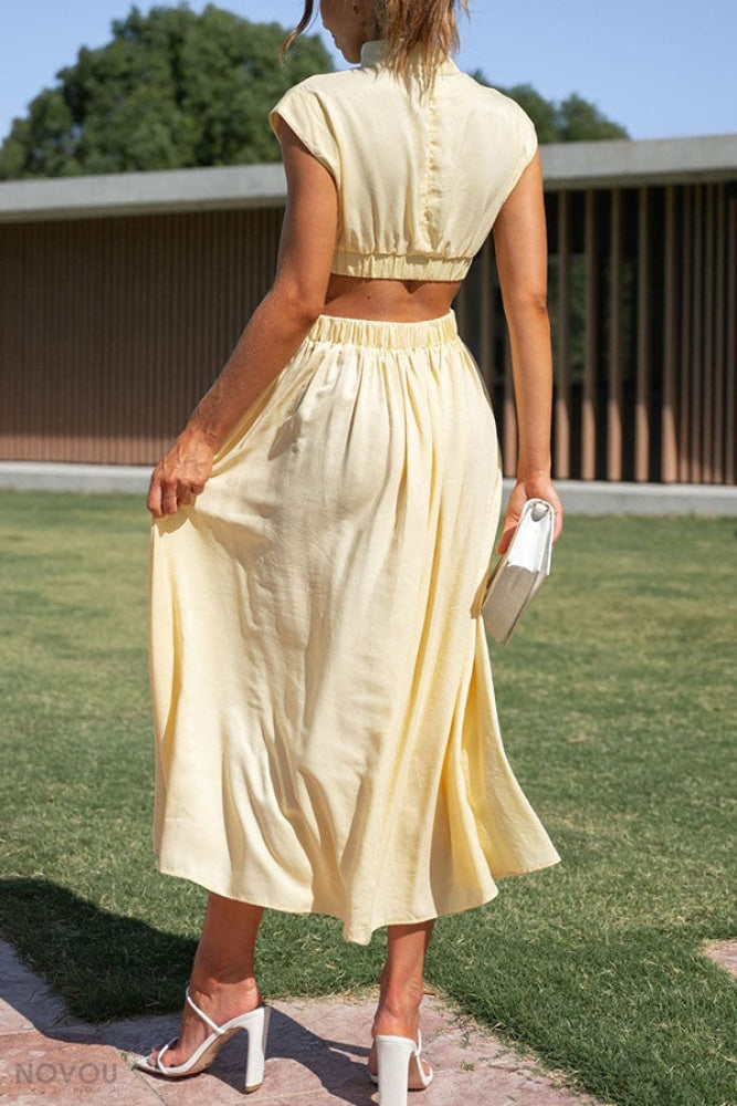 Elegante dames midi jurk, perfect voor zomeravonden. Voorzien van col en stijlvolle taille-uitsparing.