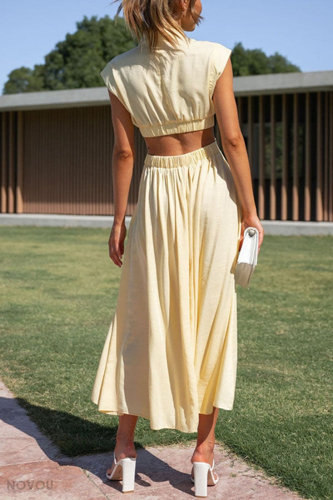 Flatterende pasvorm: midi zomerjurk met col en unieke taille-uitsparing. Trendy en vrouwelijk.