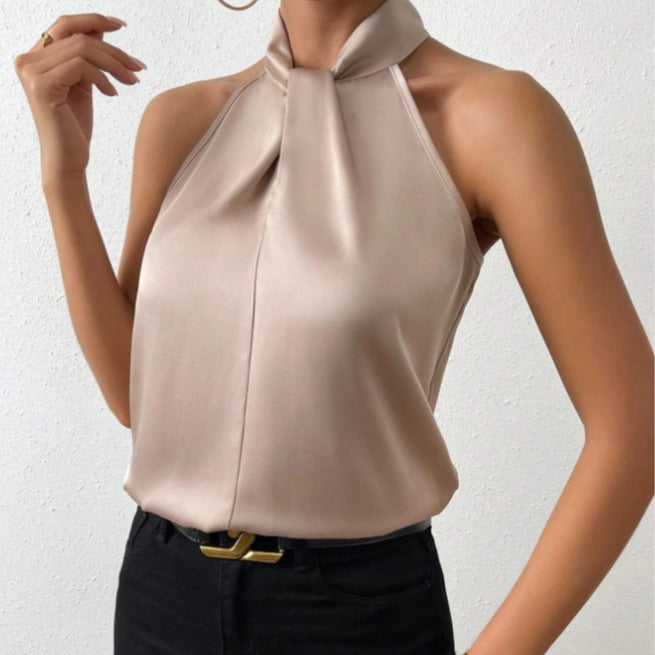 Dames mouwloze haltertop met vloeiende pasvorm, perfect voor zomer en chique gelegenheden.
