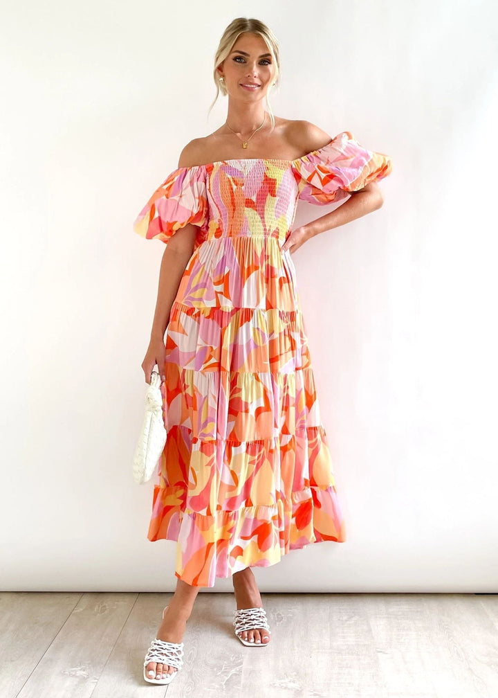 Veelzijdige off-shoulder midijurk met ruffles voor dames, perfect voor casual en feestelijke gelegenheden.