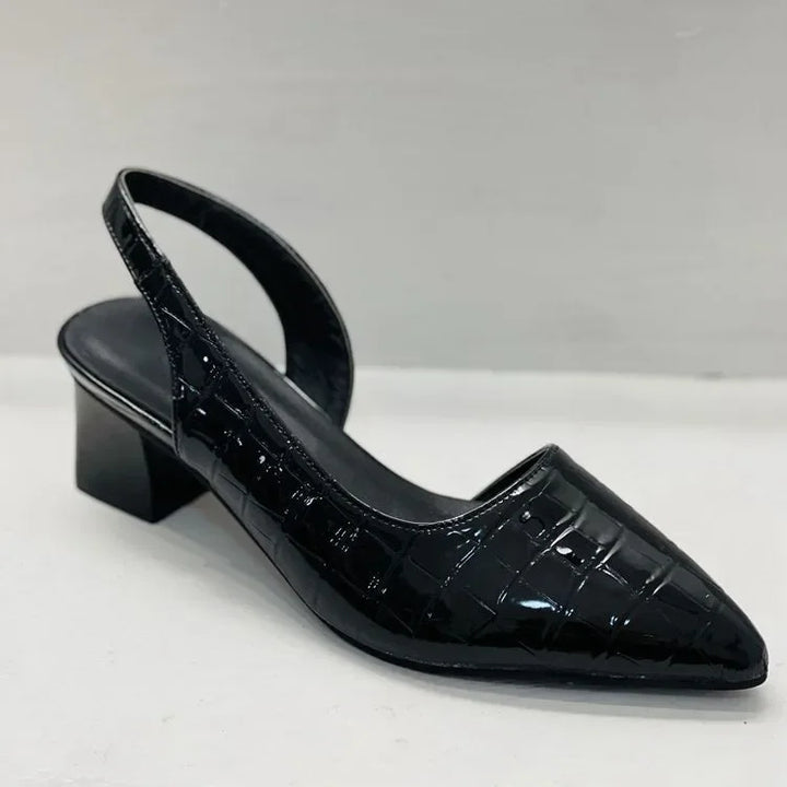 Zwarte damespumps: orthopedisch, comfortabel en elegant, met trendy croco-look. Geschikt voor feesten.