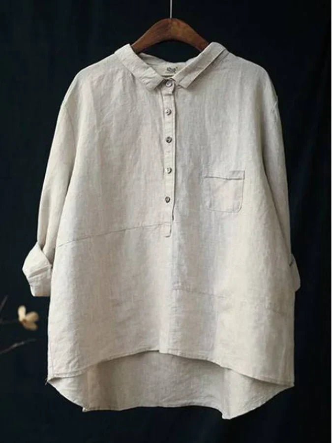 Chique damesblouse met lange mouwen, elegante hoge-lage zoom en knoopjes. Perfect voor een veelzijdige look.