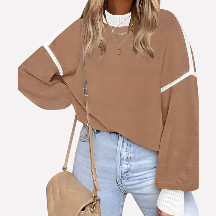 Trendy dames oversized trui met vrolijke kleurblok strepen en vleermuismouwen, essentieel voor herfstmode.
