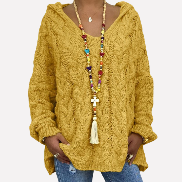 Dames oversized trui, kabelgebreid, met V-hals, gedragen als comfortabele herfstoutfit. Perfecte wintertrui.
