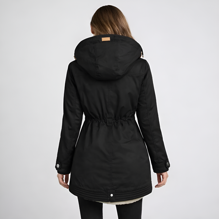 Warme dames winterjas: middellange parka met gevoerde capuchon en trekkoord in de taille, ideaal voor koud weer.