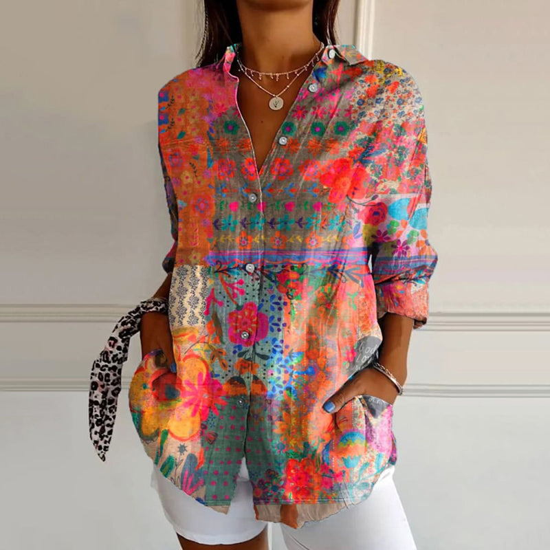 Dames roze blouse met bloemenprint, lange mouwen en knoopsluiting. Casual, chic en comfortabel.