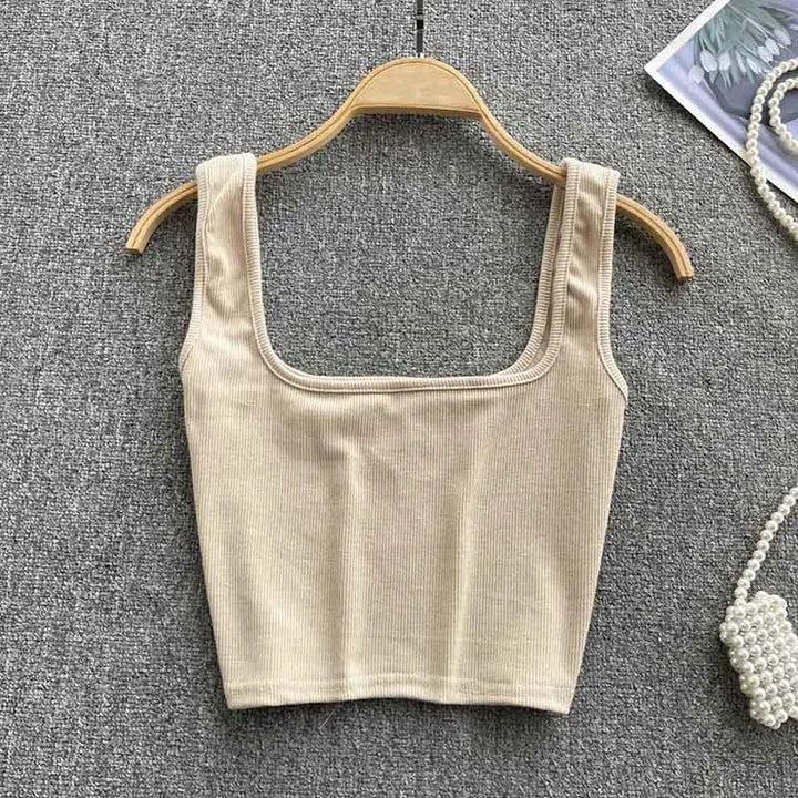 Modieuze rugloze tanktop, cropped model voor dames. Effen kleur, slim fit, ideaal voor zomerfestivals.