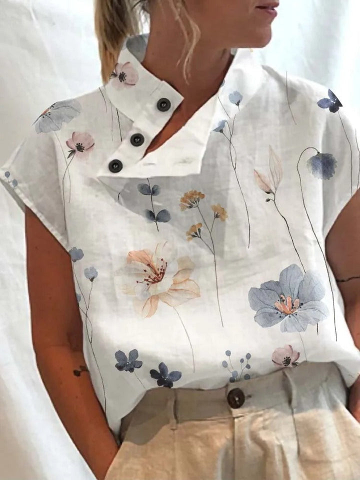 Elegante dames blouse met korte mouwen, levendige bloemen- en libellenprint; ideaal voor zomerse dagen.