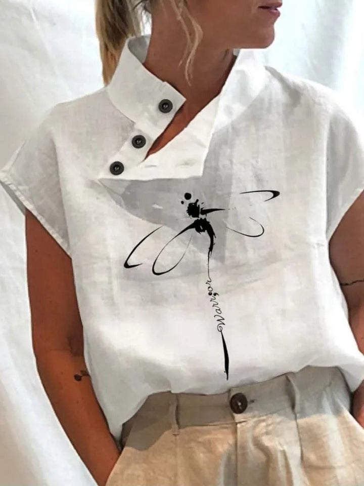 Stijlvolle dames top met korte mouwen, levendige bloemen en libellen print; combineert elegantie met comfort.